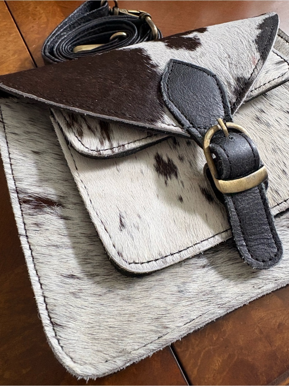 Buckle Buckle Leather Crossbody Bag in Black